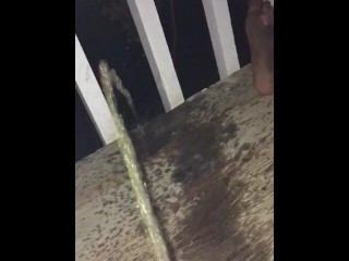 Girl peeing on her front porch 