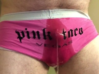 Peeing in her pink taco panties